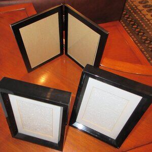 Four Black Frames, two identical sets